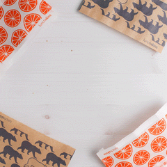 GIF of popcorn, pretzels and snacks sliding in and out of sandwich bags
