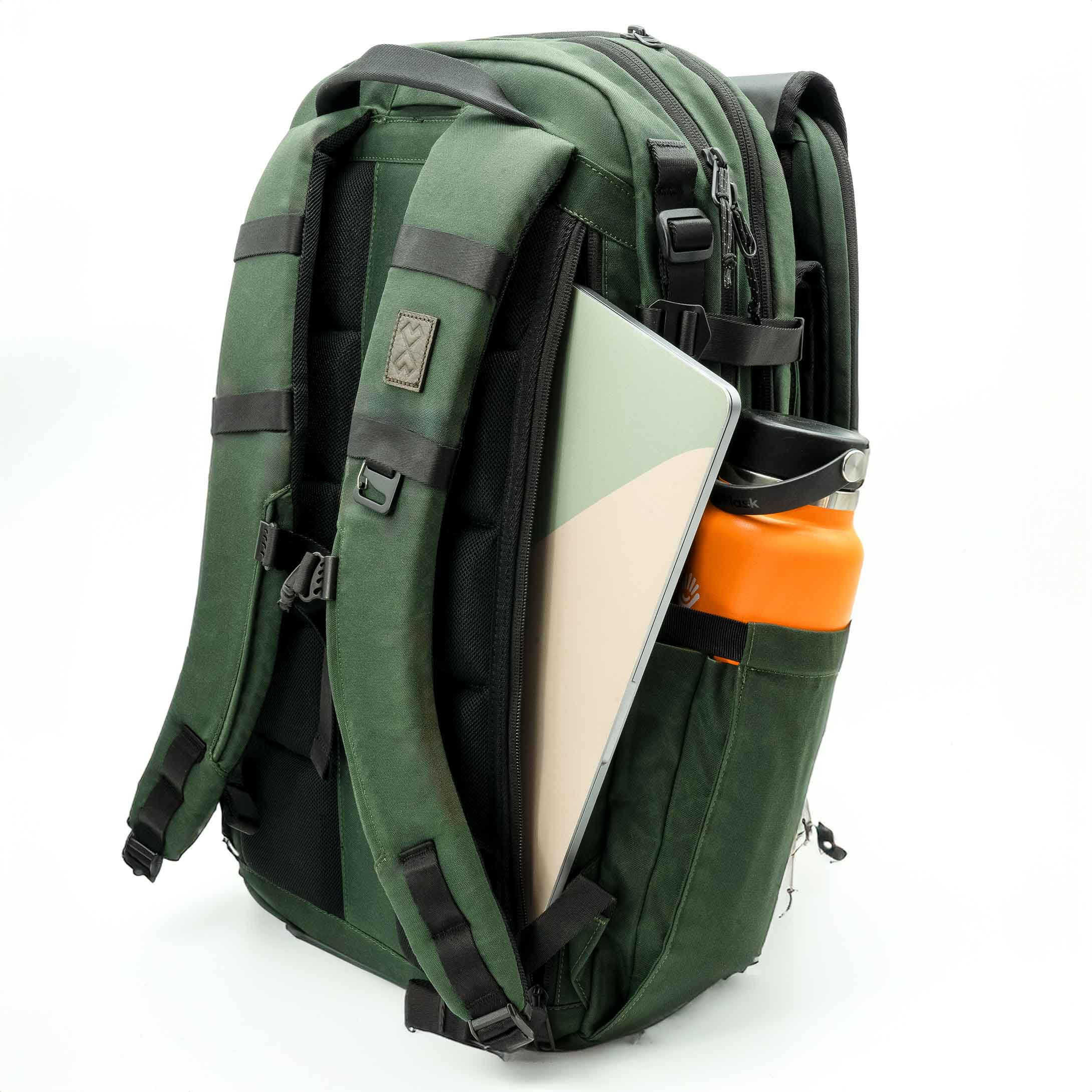 Green backpack with a laptop compartment on a white background