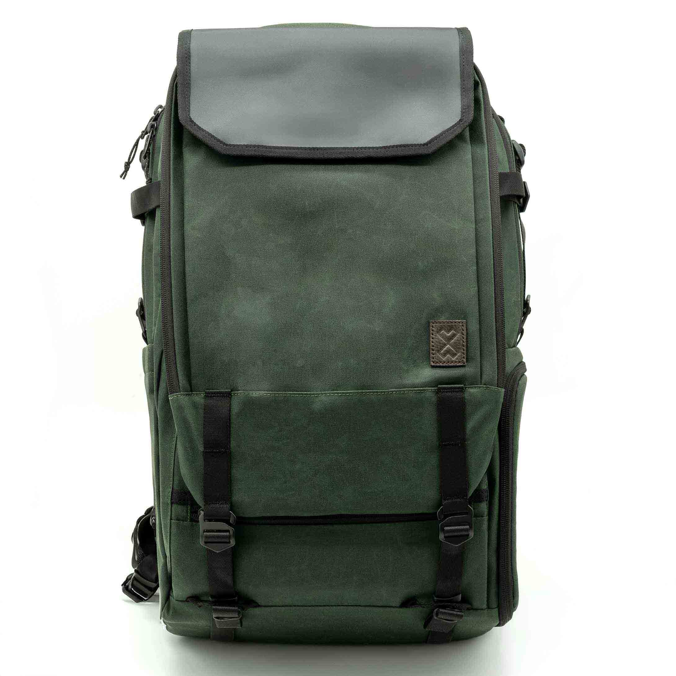 Green backpack with black straps on a white background
