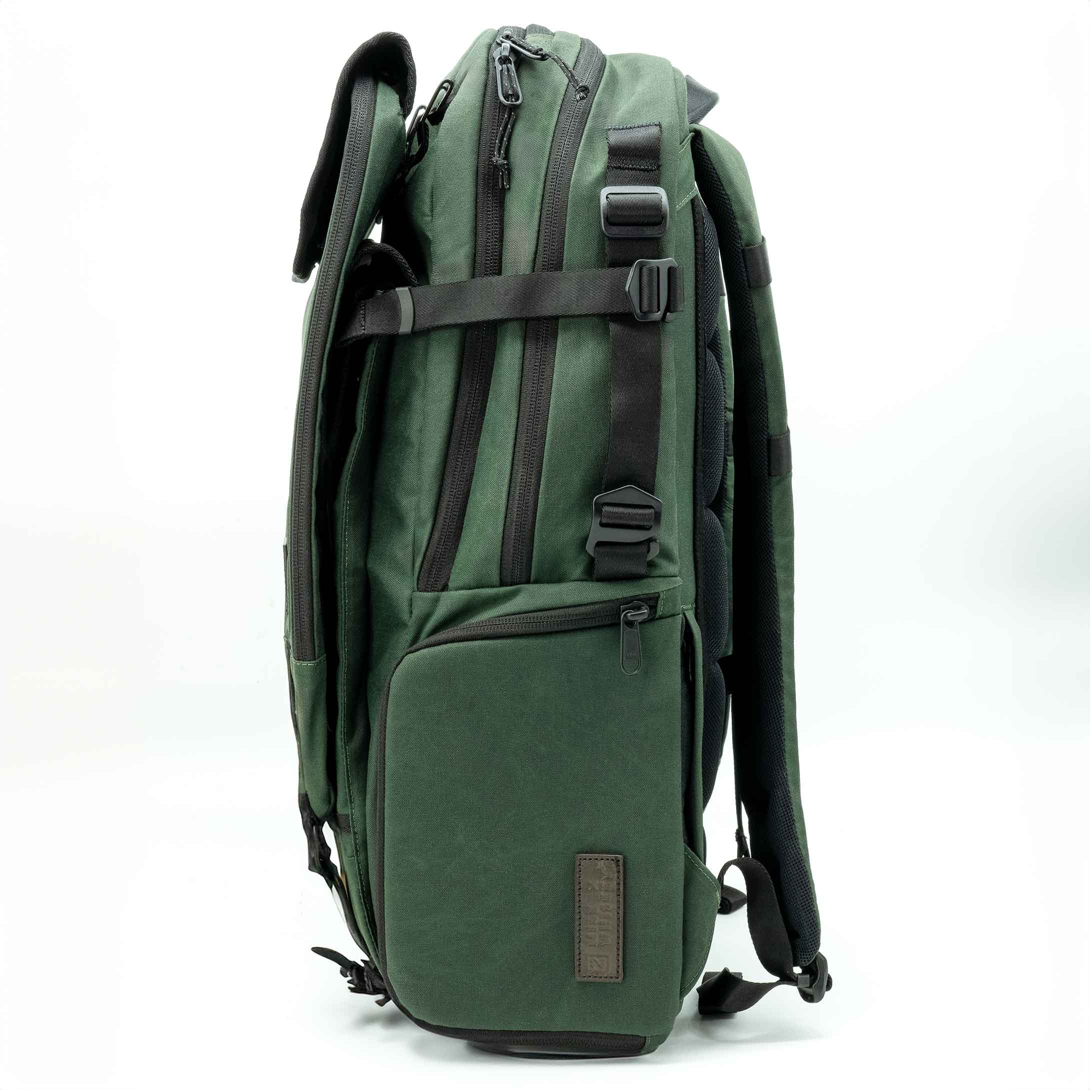 Green backpack with black straps on a white background