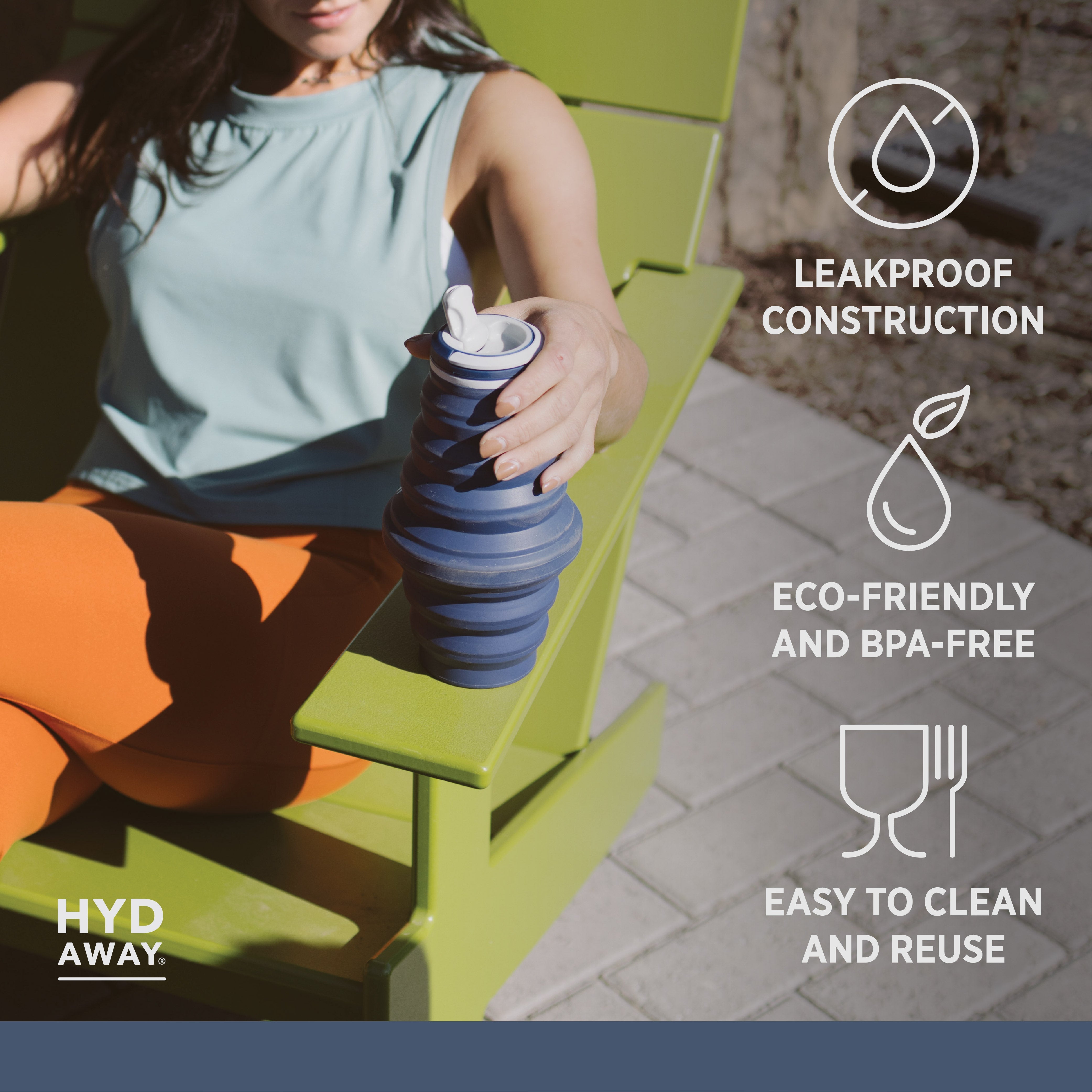 Person holding a blue collapsible water bottle with features listed on the screen.
