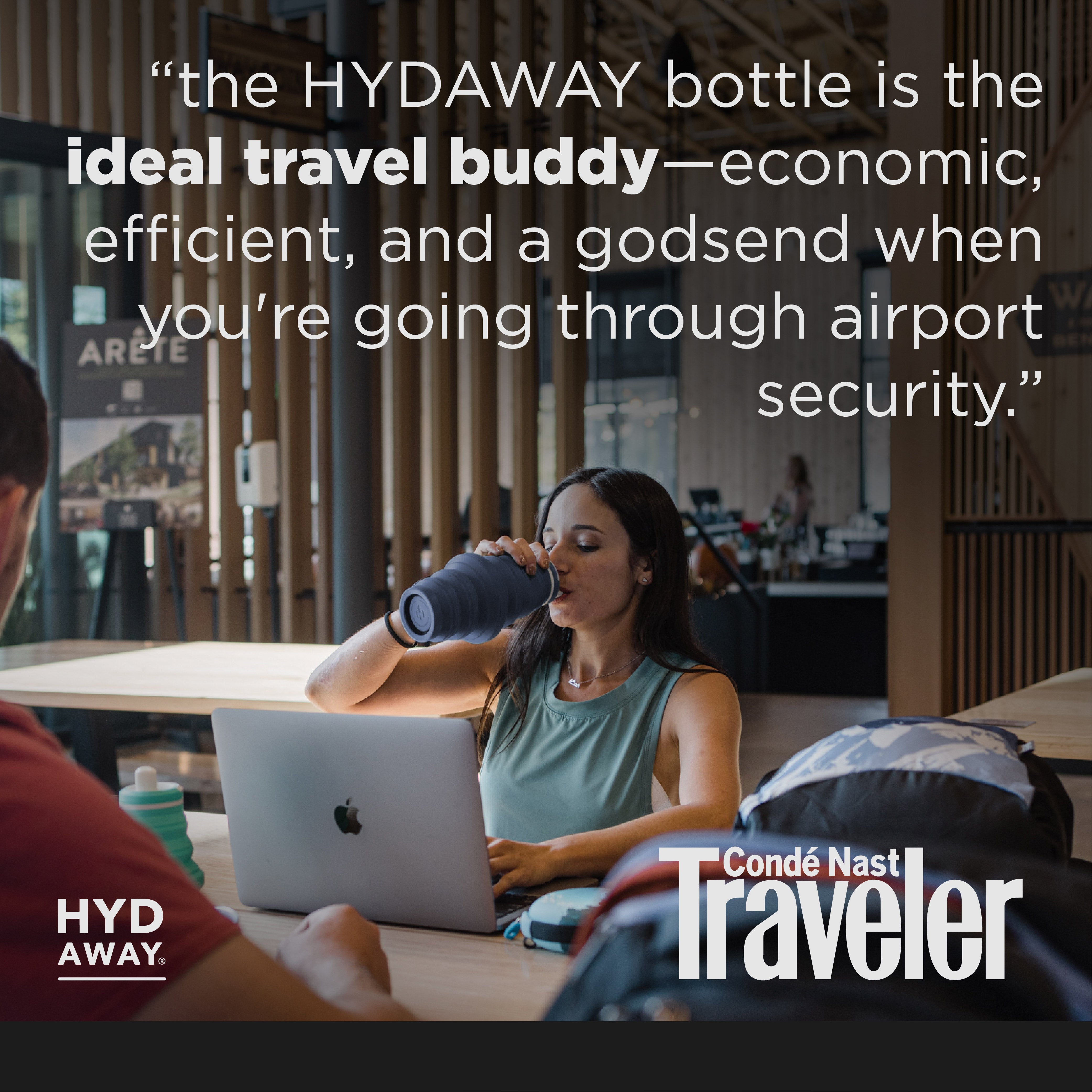 Person using a laptop with a bottle, text about HYDAWAY bottle, and Conde Nast Traveler logo.