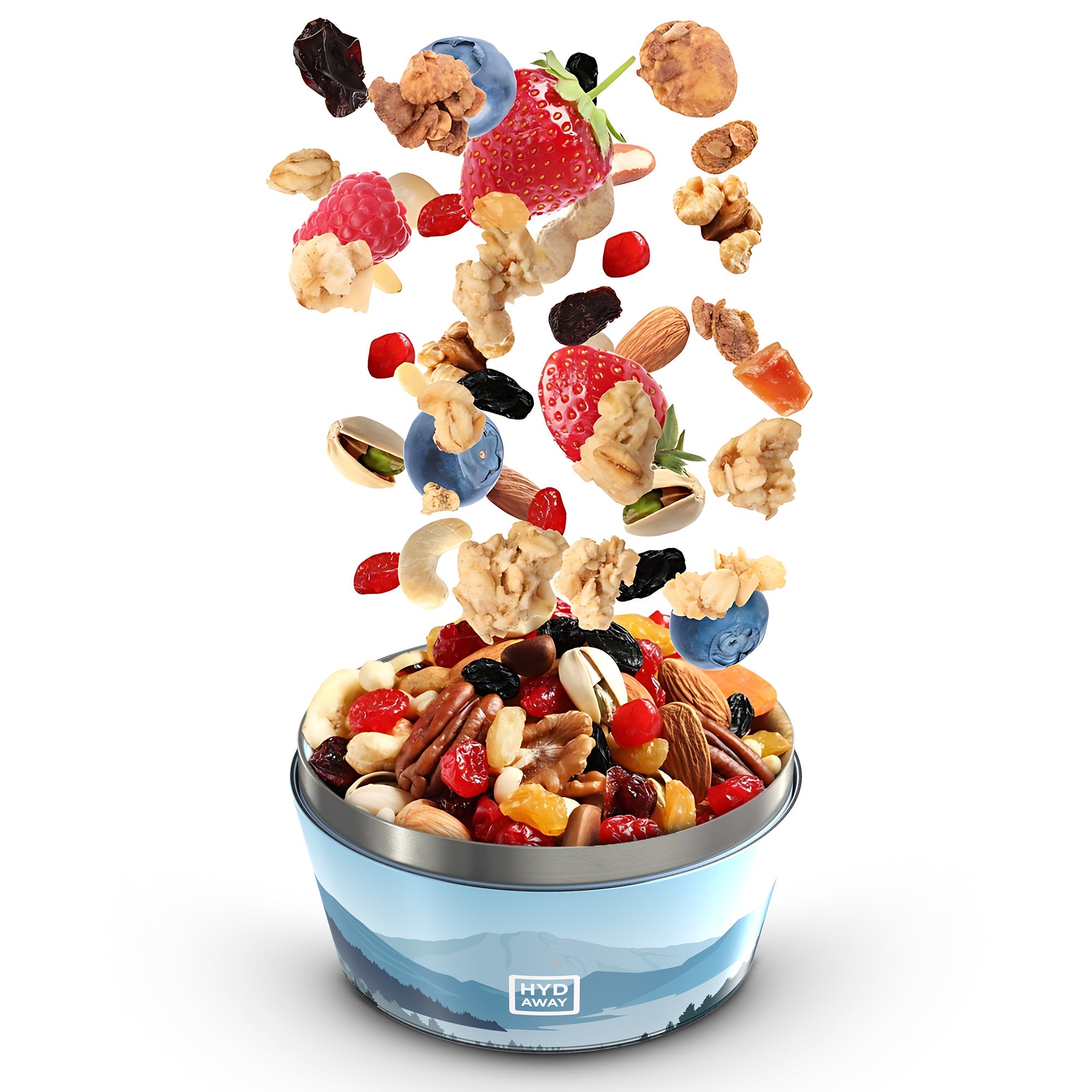 Assorted nuts and dried fruits falling into a blue bowl on a white background