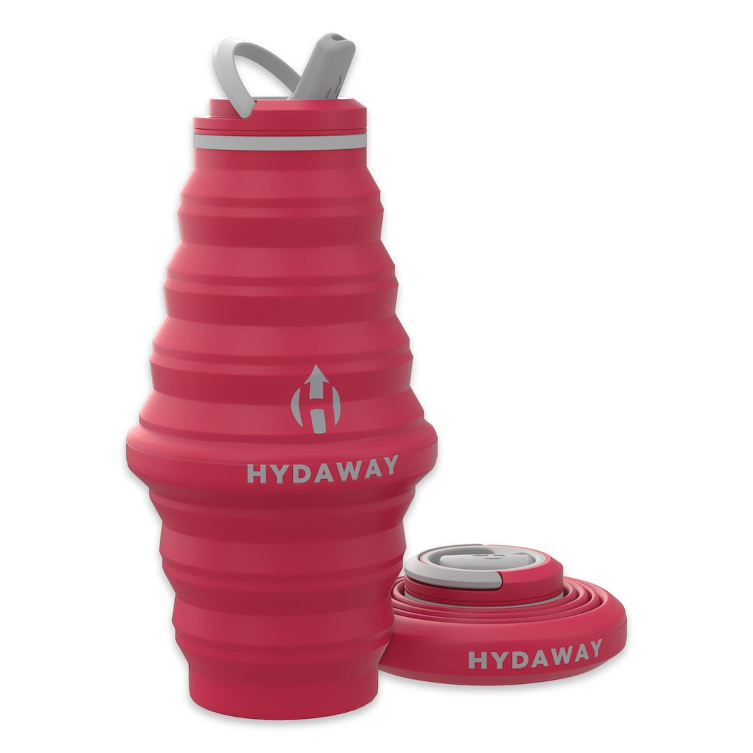 Pink collapsible water bottle with 'HYDAWAY' branding on a white background