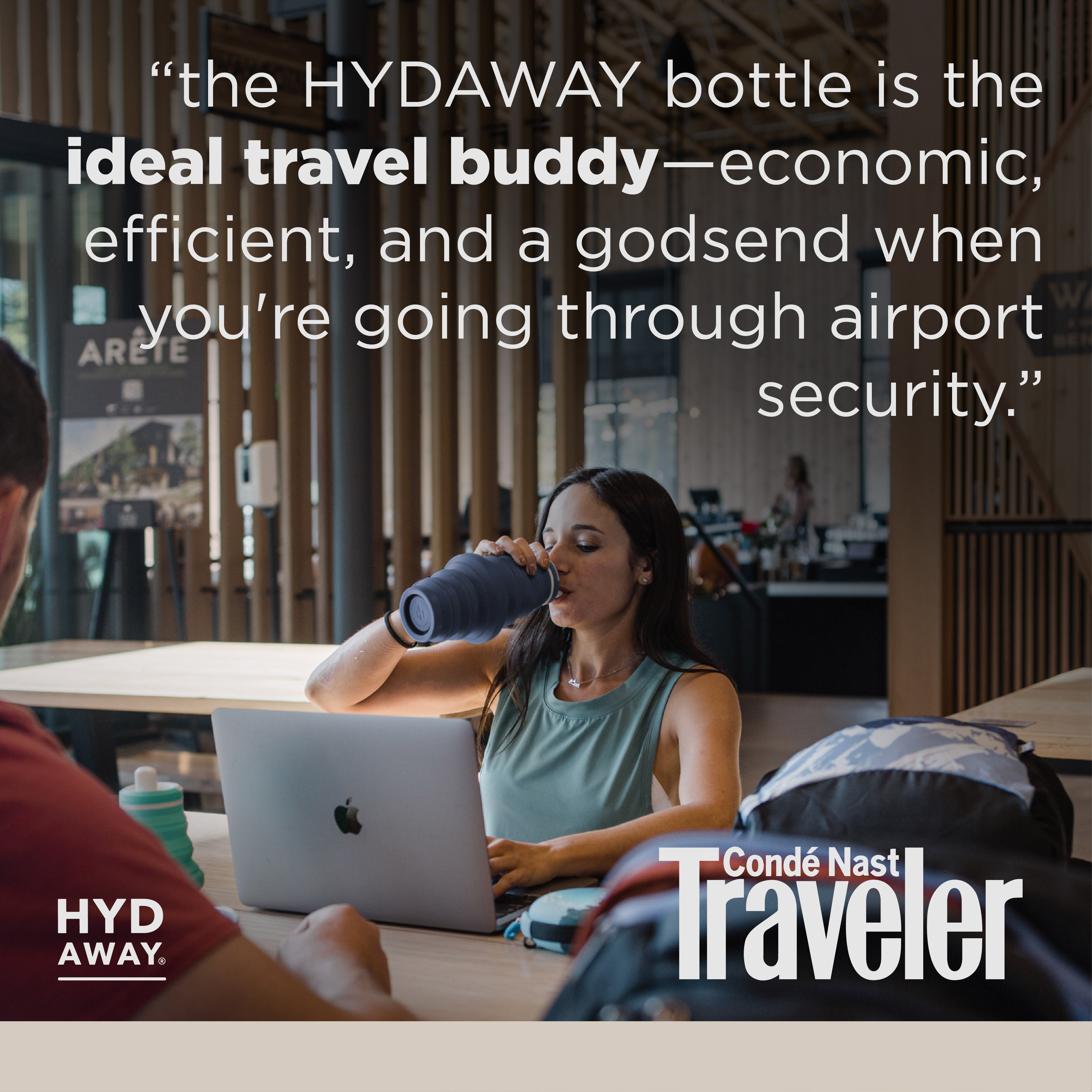 Person using a laptop with a bottle, text about HYDAWAY bottle, and Conde Nast Traveler logo.