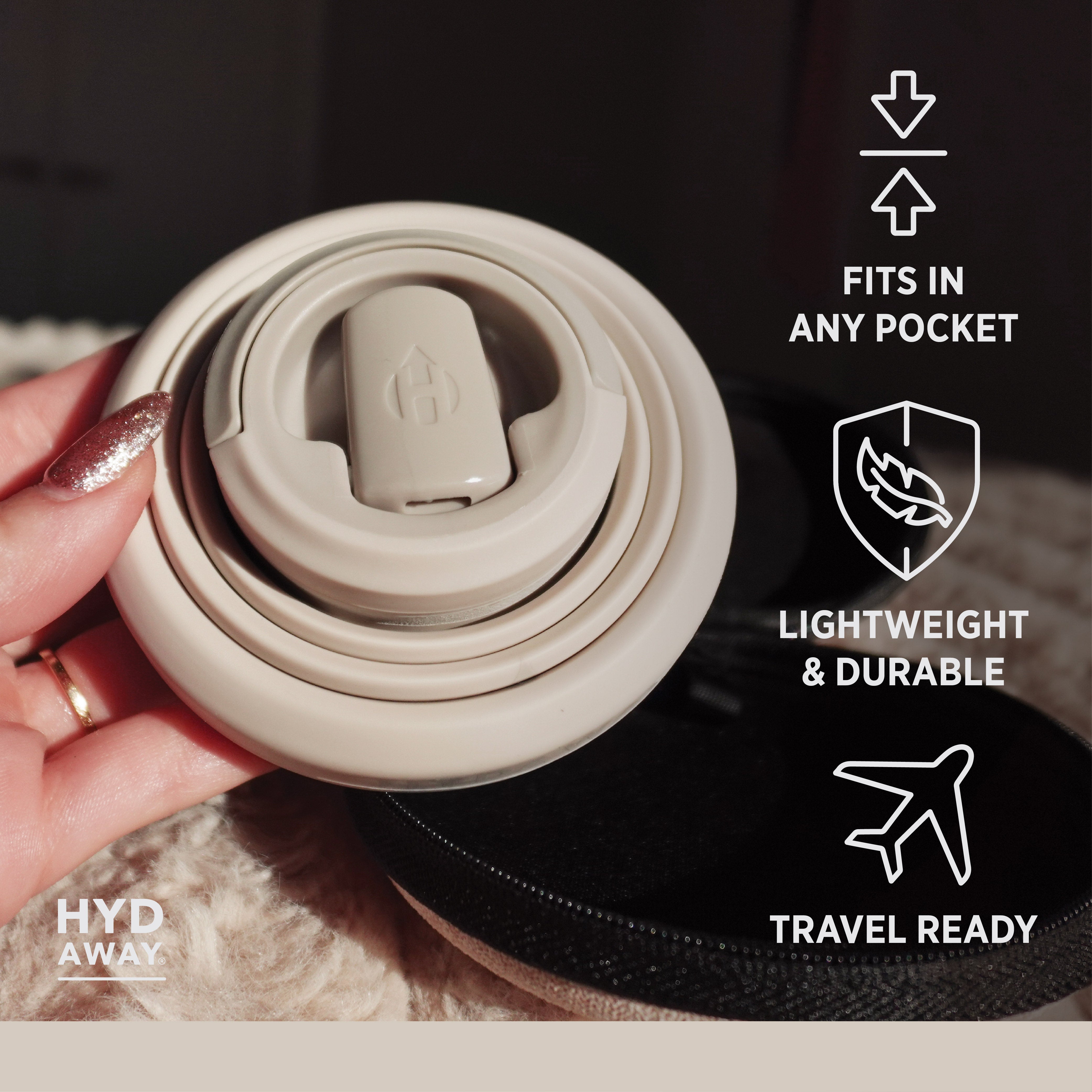 Collapsible beige travel mug held by a hand with text highlighting features like 'fits in any pocket', 'lightweight & durable', and 'travel ready'.