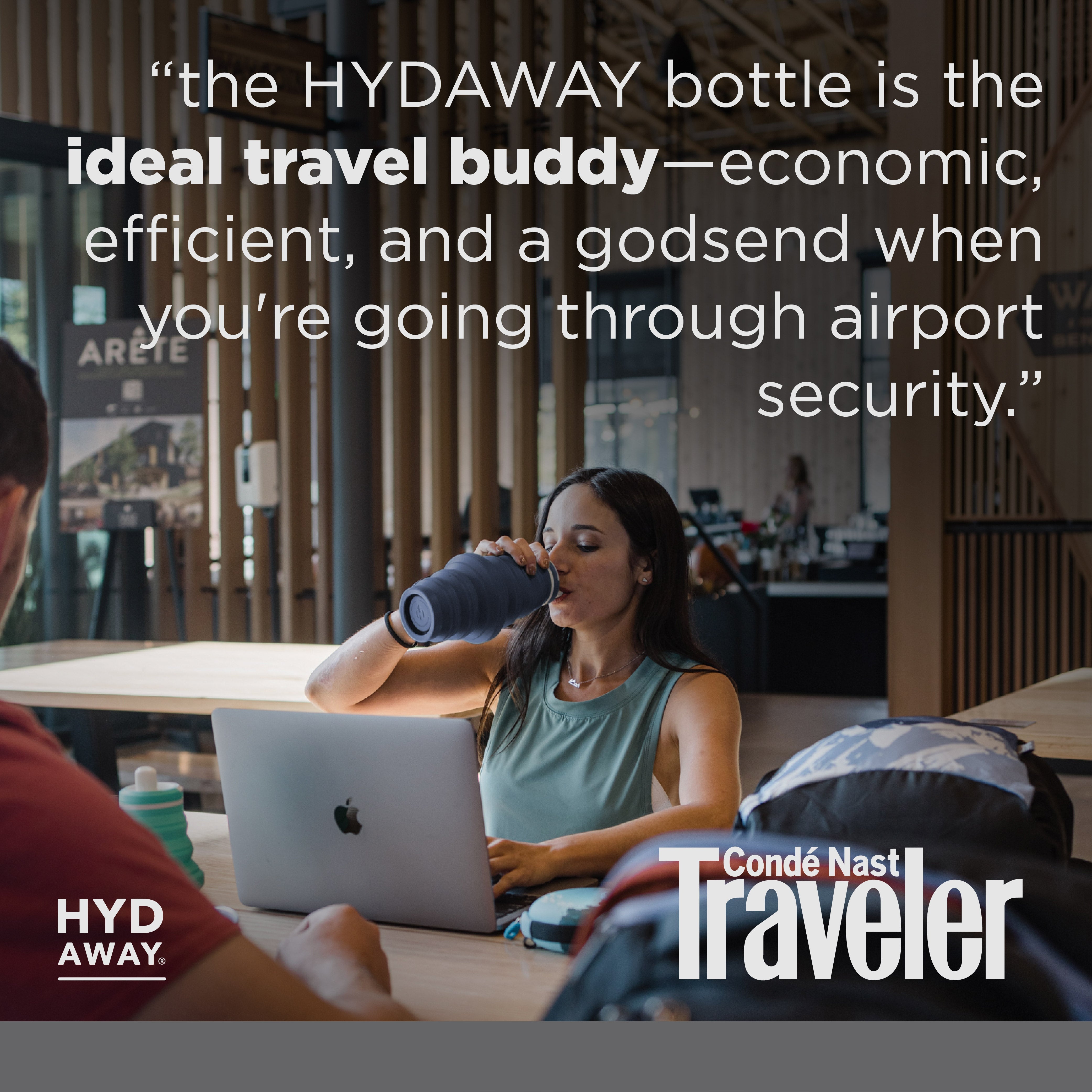 Woman drinking from a blue bottle with text about the HYDAWAY bottle, surrounded by people at an airport.