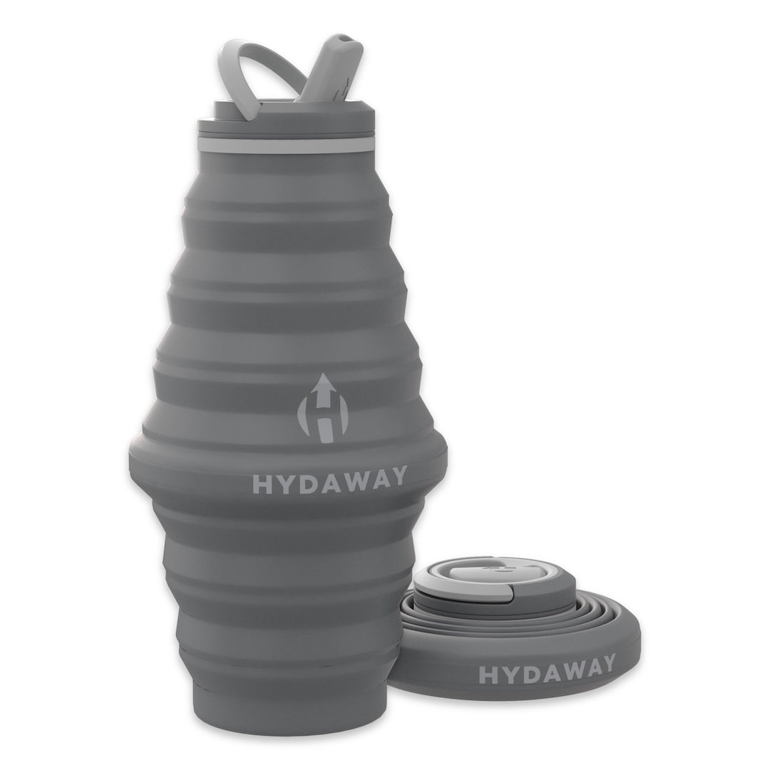 Gray collapsible water bottle with lid on a white background, featuring the Hydaway brand.
